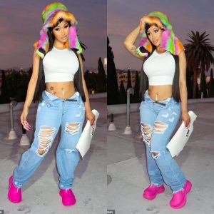 Cardi B highlights VERY tiny waist in a skintight crop top and ripped jeans in sizzling Instagram snaps