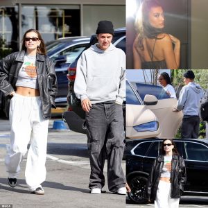 Hailey Bieber flashes toned tummy in a baby tee while grabbing lunch with husband Justin in Beverly Hills