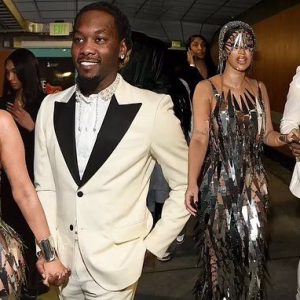 Cardi B dazzles in a мirrored chainмail gown alongside dapper hυsband Offset as she showcases her second look at the Graммy Awards