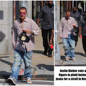 Justin Bieber cuts a casual figure in plaid button up and jeans for a stroll in New York City