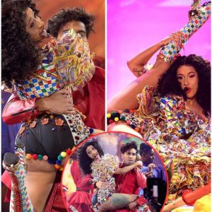 Cardi B flaunts great adaptability as she lifts foot over head for vivacious I Like It execution at American Music Grants